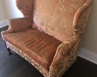 Salmon and patterned throne double love seat. 