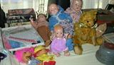 dolls, quilt pieces, teddy bear