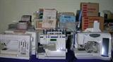 We have 4 fabulous computerized sewing machines with various talents, including serging and embroidery. There are also dozens of pattern cards to be used with a couple of them, and many have accessories.
The machines offered are:
Elna Diva 9000 (Computerized embroidery and applique)
Husqvarna Viking Huskylock 936 (serger)
Brother Pacesetter (computerized embroidery)
Jenome Memory Craft 4800 (quilting)
There are many sewing machine accessories available as well, from dozens of computer cards that contain programs for various embroidery designs, to specialty feet, needles, etc.
We also have miles and miles of fabric in every type, color, and length, along with all the notions and trimmings you could be looking for.
We've filled tables with bagged lots of threads, needles, sewing accessories, trims, gadgets, buttons ... pretty much everything you could buy at JoAnne Fabrics and could possibly need for whatever projects you're planning!
There is some spectacular yarn