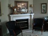 Pair of nice vintage blue chairs, pair of mantle lamps,  beautiful oak antique clock, pictures, and other accessories.