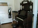 Late 1800's reed organ and stool.  It plays!!! (if you pump it!!!)  Also,  large white vintage chifferobe with mirror.