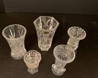 Set of five small crystal vases