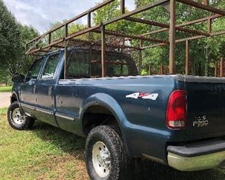 Lot # 40 $5500 ~ Ford F250 '99 4X4 - 4 wheel drive/285K miles Hide Away hitch and Gooseneck hitch with work racks, gas (sorry TRUCK not discounted)
