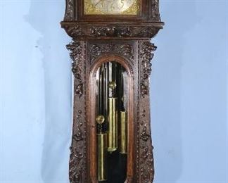 084 - Oak heavily carved 5 tube grandfather clock by R.J. Horner with Tiffany works, has carved figures and claw feet, 8 ft. 10 in. T, 27 in. W, 27 in. D.