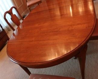 24 Dining room table-table and buffet are sold as a set There are leaves and pads. Table has 8 chairs price 695.00