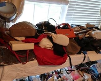 lots  of purses  and     lots  of  cosmetic  items