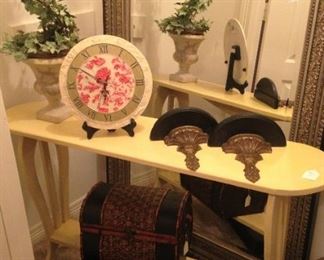 Another large mirror; long yellow sofa table