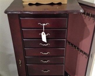 Each side opens for hanging necklaces