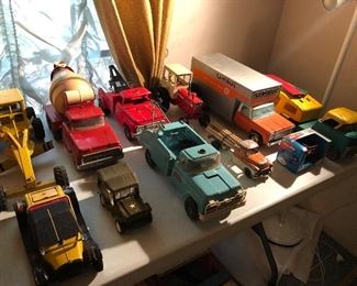 Buddy L, Tonka, Structo and Erte diecast trucks.