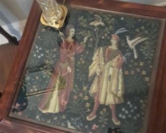 Small table with tapestry panel under glass; small Waterford lamp