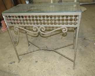 ITEM 22-- Vintage painted iron glass top table with floral center. 24" long, 12 " wide, 21 1/2" high $95.00