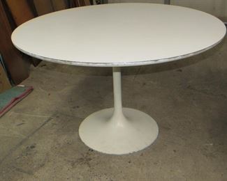 ITEM 5 - Saarinen style tulip base table with laminate top. has edge wear , paint loss on base. 47 1/2"diameter top 29" high $250.00