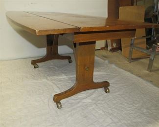 ITEM 13 -- walnut drop side convertible coffee table into dining table, 60" long, 40 1/2" wide, 27 1/2 " high $120.00