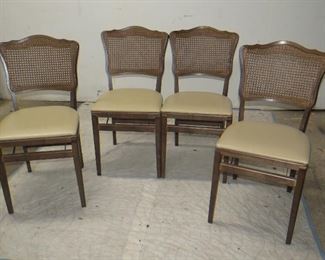ITEM 24-- Set of 4 provincial cane back folding chairs. $125.00