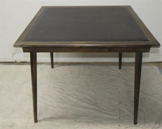 ITEM 57---MCM vinyl top folding card table. 28 1/2" high , 34" square. $75.00