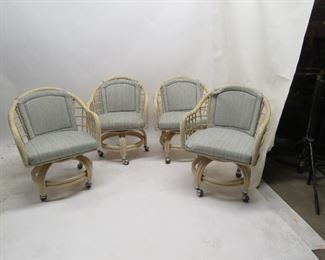ITEM 97---4 rolling rattan upholstered swivel dining chairs, marks on material, 24" wide,23" deep,31" high. 17" high to seat. $160.00