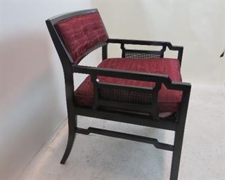 ITEM 139---James Mont style black arm chair with caned sides, 25.75" wide, 23.75" deep, 29.5" high, 15" to seat. $100.00