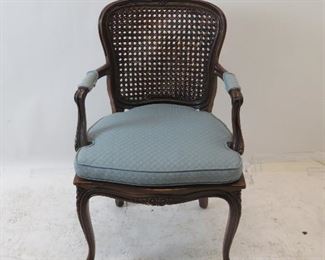 ITEM 143 ---French walnut armchair with double cane back. 22.5" wide, 20" deep, 36" high, 17" to seat. $75.00