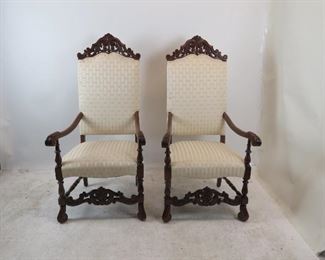 ITEM 144---Pair of Jacobean hand carved walnut throne arm chairs. 26" wide, 27" deep, 53.75" high, 18" h to seat. $500.00