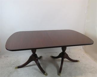 ITEM 148 ---Henkel Harris mahogany double pedestal table w 3 leaves, model 2208. 44" wide,29.75" high, 68" long closed, plus 3 -12" leaves. $1900.00