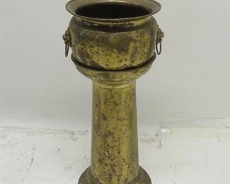 ITEM 182 ---2 part jardiniere w lions handles, has some dents and holes. 31' high, 12 3/4" wide. $30.00