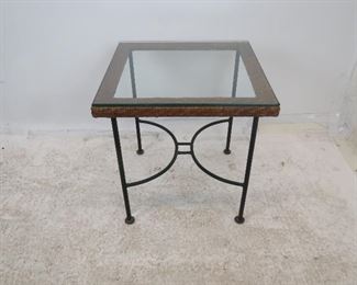 ITEM 216--- MCM wicker and iron base table with glass top. 20" square, 20.75" high $100.00