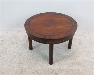 ITEM 228--- Rosewood brass inlaid table. surface imperfections. 24.75" diameter, 16" high. $60.00