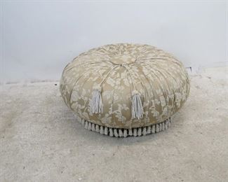 ITEM 249--- upholstered pleated ottoman on legs, missing a couple tassels. 36" diameter, 16" high. $75.00