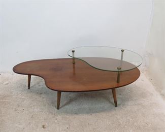 ITEM 259--- MCM boomerang style coffee table, chips on glass, surface marks, stains. 51" long, 27.25" wide. 16.75" high $75.00