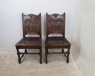 ITEM-358-- Pair of Carved Jacobean oak cane seat chairs. chip missing on runner, roughness and chips . 20.5" wide, 20" deep, 40.5" high, height to seat 18.25 $150.00
