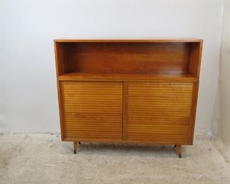 ITEM-364- 2 part MCM sliding door cabinet. 47.75" wide, 11.25" deep, 43" high. top is 12.75" high. $150.00