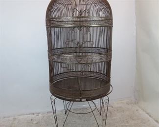 ITEM--371-- 2 part Large contemporary metal bird cage on -stand. Base, 23.25" high, 35" diameter, top 55" high, total height on stand-78". $250.00