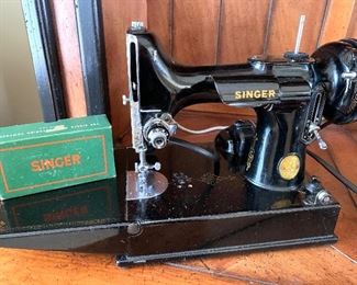 vintage Singer sewing machine, with attachments and hard case. 
