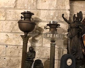 Wonderful antique oil lamps and figural clocks.