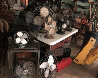 vintage fans galore and toolboxes.