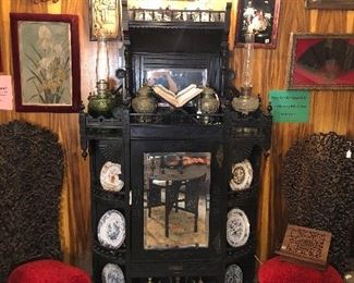 Antique Eastlake mirrored etagere with Anglo Indian High Back Chairs.