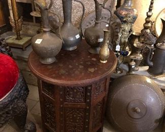 Middle Eastern inlaid table with cobra handled tea pots.