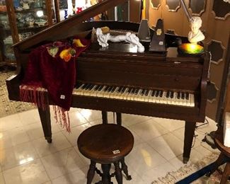 Beautiful antique Premier Baby Grand Piano Corp. piano with ivory keys, 2 ball and claw piano stools.  vintage metronomes.