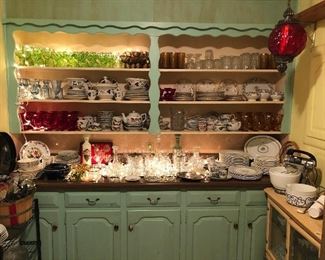 The laundry room featuring beautiful drinking glasses, some vintage chinese Dragon Restaurant ware, crystal and pretty dishes.