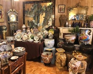 Asian Room with grandfather clock, vintage hand painted 2 sided screen, elephants, china, antique Japanese pots, and lots of different Chinese fish bowls.