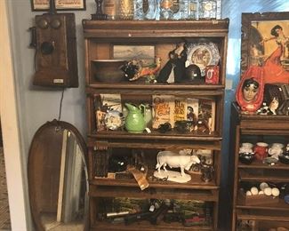 vintage liquor bottles, antique wall phone, Texas books, Marx train set, tobacco spittoon.