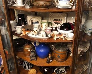 Railroad plates, pottery, railroad lantern chimney and glass, English wooden biscuit and coffee canisters, and German punch bowl and cups.