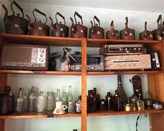 vintage radios.  vintage and antique bottles including a Fort Worth soda bottle.