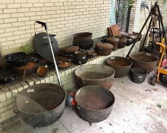 cast iron kettles, cauldrons, skillets, and stands.