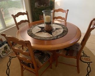 $650- Fabulous Round solid wood table and four chairs 