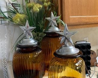 $78~ ARTLAND AMBER RIBBED SQUARE GLASS SET OF THREE PEWTER TOP CANISTERS WITH STAR OF TEXAS MOTIF . 