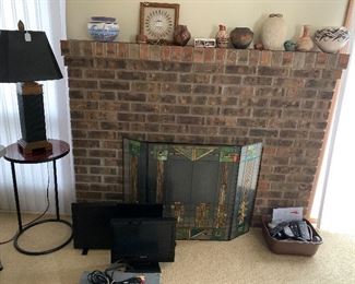 Two TV’s, DVD player, Fireplace screen and Native American art