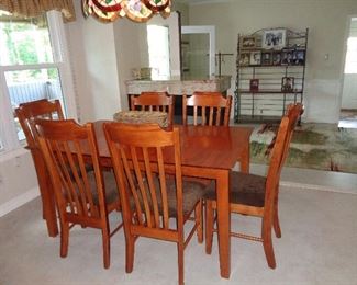 KITCHEN TABLE WITH UNDER TABLE LEAF STORAGE AND 6 CHAIRS  $225.00