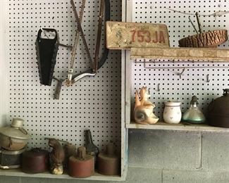 Various antique and vintage oil lamps, hand tools, license plate, more