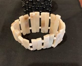 $12       Pair of stretch bangles black beades and beige